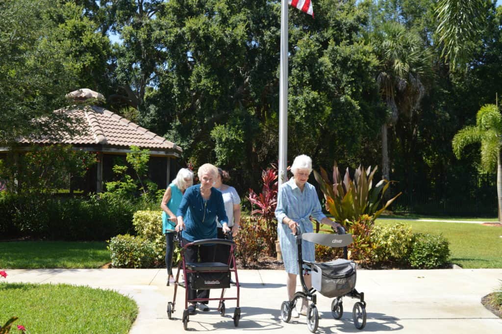 inspired living residents walking together on path